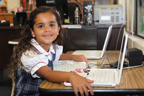 Female student sitting in front of laptop