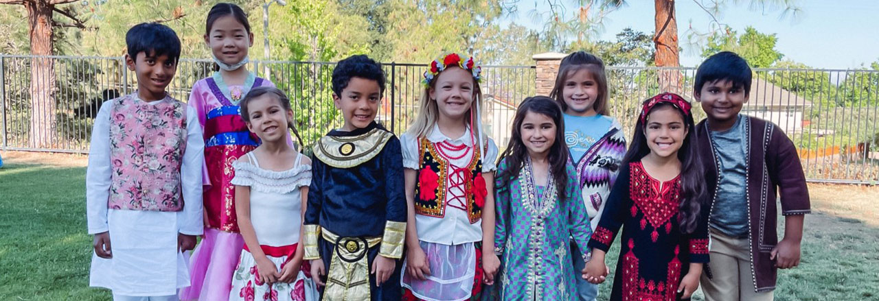 Elementary students in various cultural attire